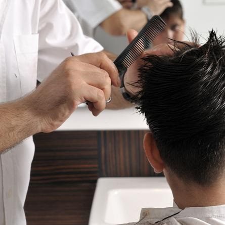 A hair salon cutting a client's hair in Tucson, AZ